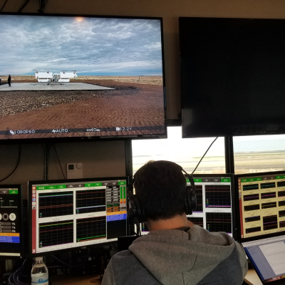 man looking at many screens